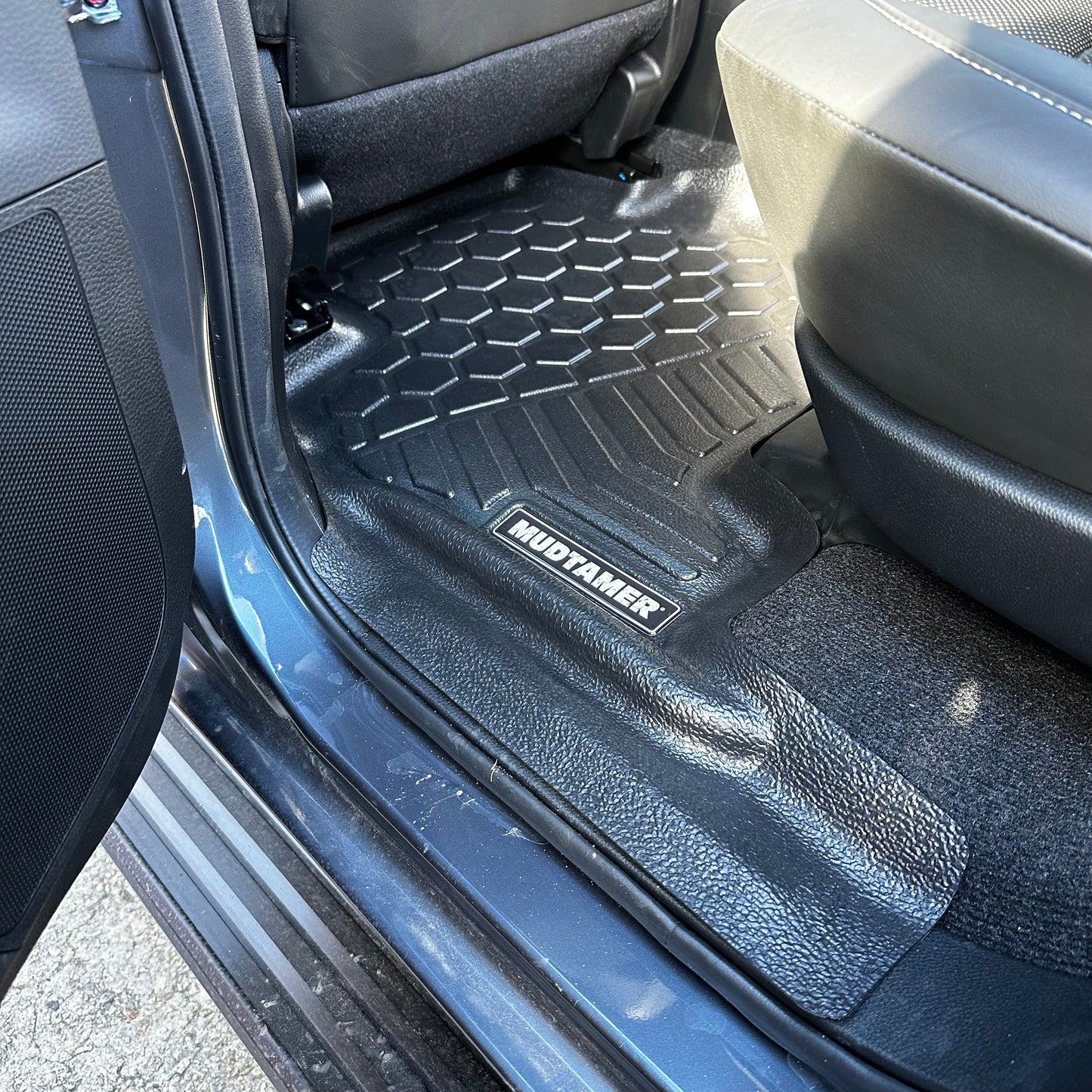 Rear MUDTAMER floor mat installed in vehicle