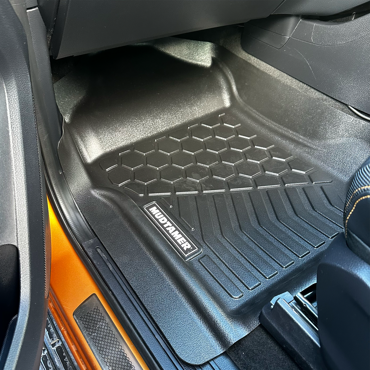 Front passenger MUDTAMER floor mat installed in vehicle