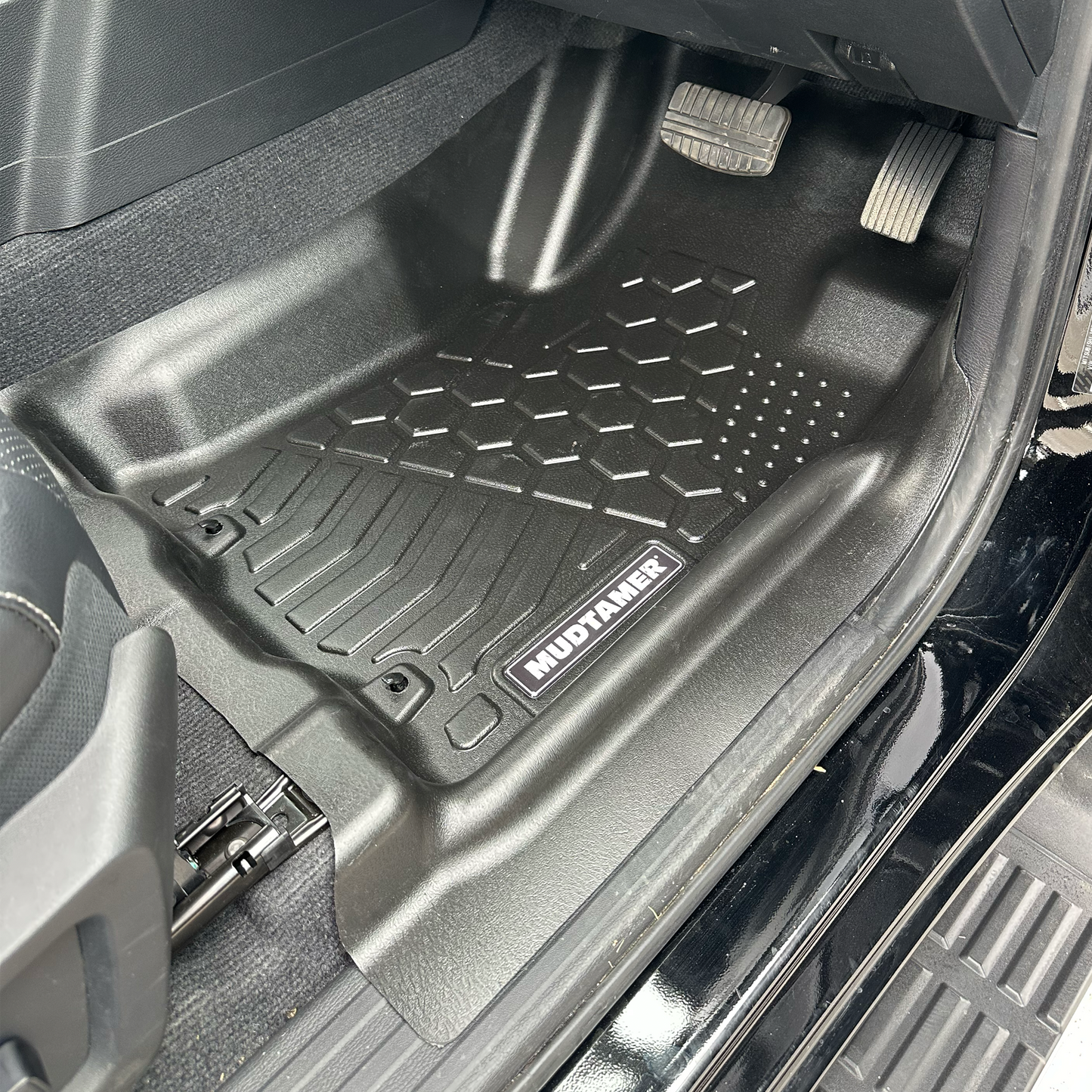 MUDTAMER driver's side mat installed in a 2024 Mitsubishi MV Triton