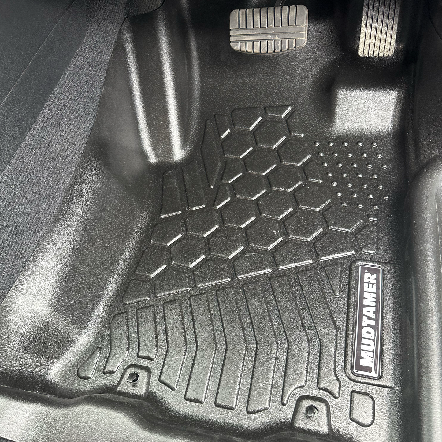MUDTAMER front driver's side mat installed in a 2024 Mitsubishi MV Triton