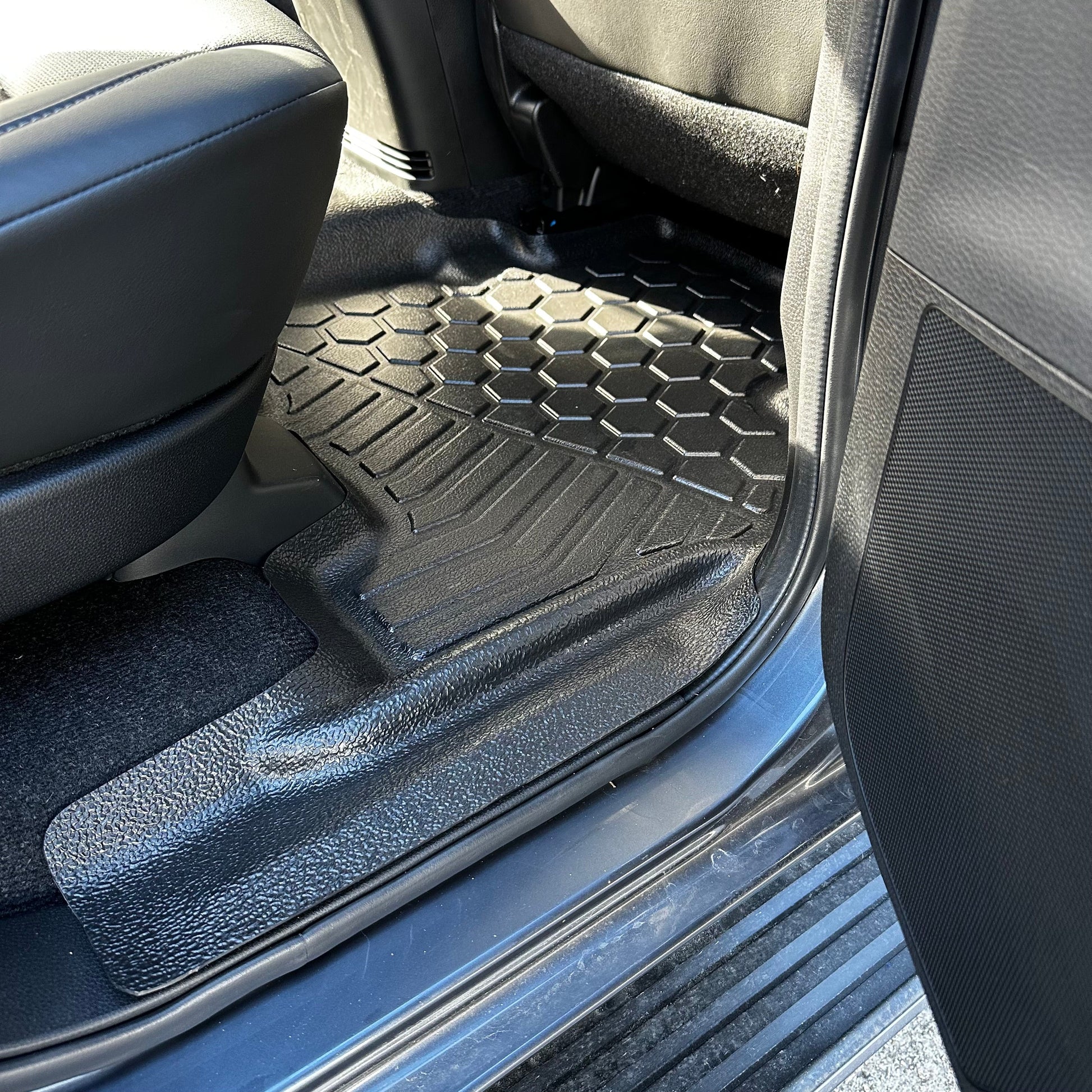 Rear MUDTAMER floor mat installed in an Isuzu MUX